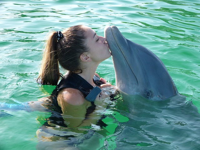 A woman with a dolphin.